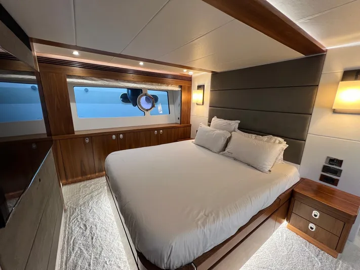  Yacht Photos Pics Luxurious bedroom interior of 2016 Sunseeker 75 Yacht with modern design and large window.
