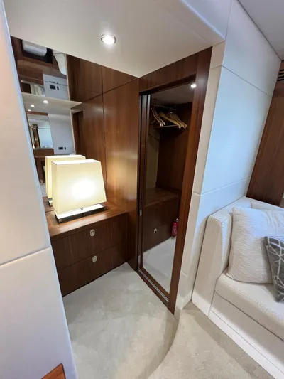  Yacht Photos Pics Luxurious interior of 2016 Sunseeker 75 Yacht with elegant wood finishes and cozy seating.