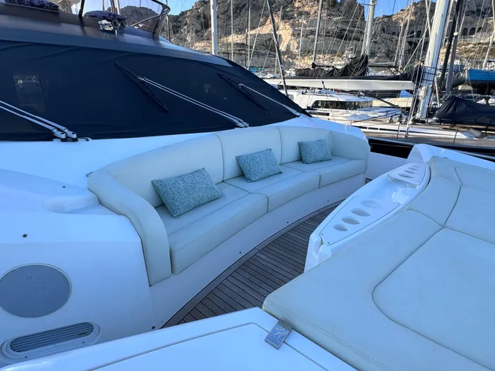  Yacht Photos Pics Luxurious seating area on a 2016 Sunseeker 75 Yacht, docked in a marina.