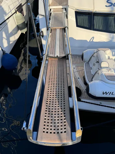  Yacht Photos Pics Gangway of 2016 Sunseeker 75 Yacht with tender in marina.