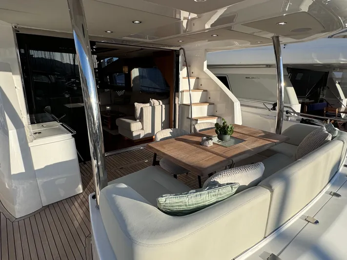  Yacht Photos Pics Luxurious 2016 Sunseeker 75 Yacht with elegant outdoor seating and dining area.
