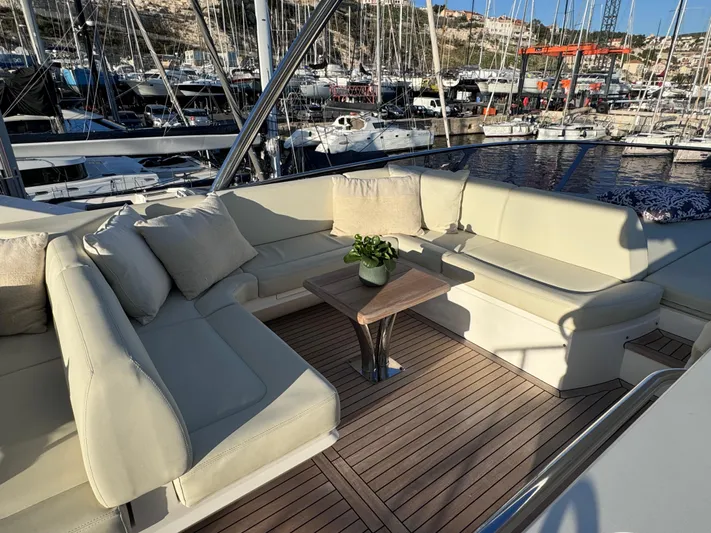  Yacht Photos Pics Luxurious Sunseeker 75 Yacht 2016 with elegant outdoor seating and marina view.