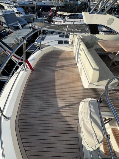  Yacht Photos Pics Sunseeker 75 Yacht 2016 with teak deck and luxurious seating area in marina.