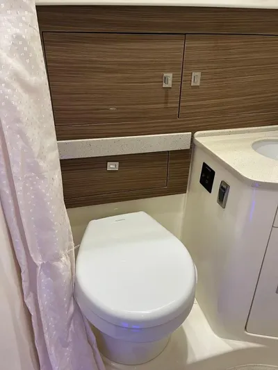 Bite Me Yacht Photos Pics 2017 Boston Whaler 420 Outrage bathroom interior with modern fixtures.