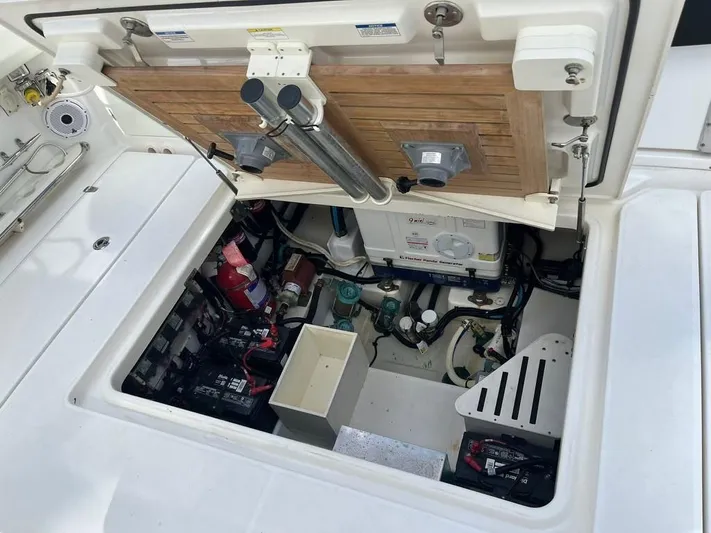 Bite Me Yacht Photos Pics 2017 Boston Whaler 420 Outrage engine compartment with equipment and storage.