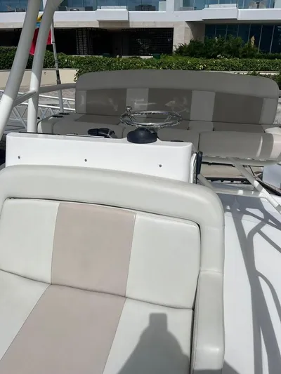 Bite Me Yacht Photos Pics 2017 Boston Whaler 420 Outrage boat interior with beige and white seating.