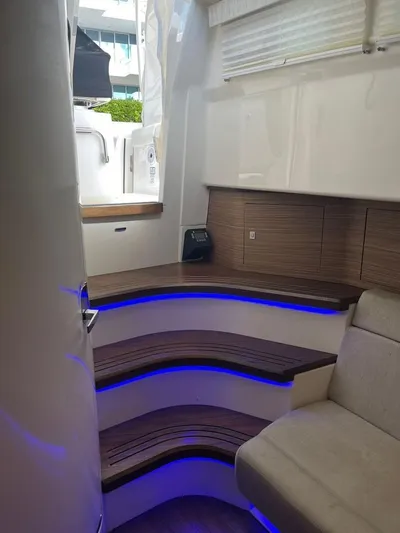 Bite Me Yacht Photos Pics Interior of 2017 Boston Whaler 420 Outrage with modern seating and ambient lighting.