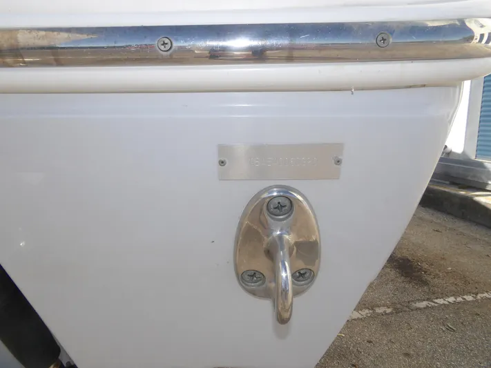  Yacht Photos Pics 2020 Cobia 320 Center Console boat hull with metal fittings and identification plate.