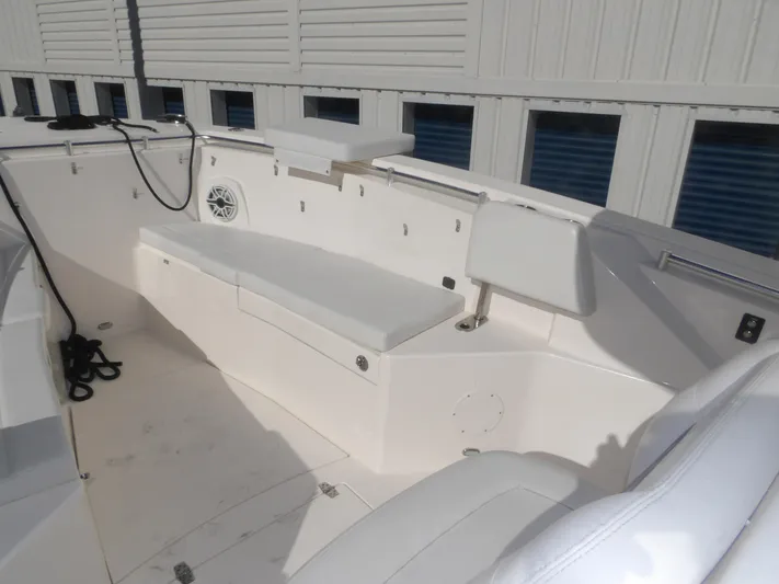  Yacht Photos Pics 2020 Cobia 320 Center Console boat interior with white seating and storage compartments.