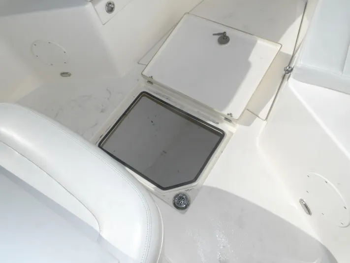  Yacht Photos Pics Cobia 320 Center Console 2020 boat deck with storage compartment and seating.