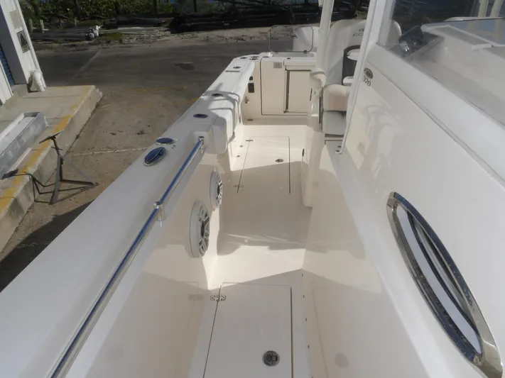  Yacht Photos Pics 2020 Cobia 320 Center Console boat interior, featuring spacious deck and sleek design.