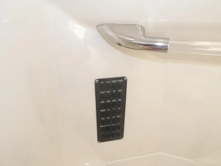  Yacht Photos Pics Control panel and handle on 2020 Cobia 320 Center Console boat interior.