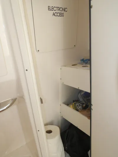  Yacht Photos Pics Interior storage area of 2020 Cobia 320 Center Console boat with electronic access panel.