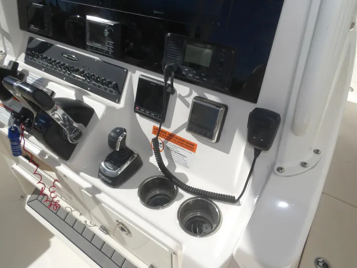  Yacht Photos Pics Control panel of 2020 Cobia 320 Center Console boat with navigation and communication equipment.