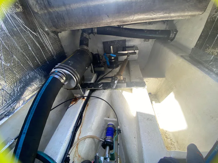 Lah De Dah Yacht Photos Pics Engine compartment of 2007 Manta 44 Power Cat with visible hoses and components.