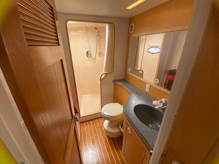 Lah De Dah Yacht Photos Pics Bathroom interior of 2007 Manta 44 Power Cat with shower, sink, and toilet.