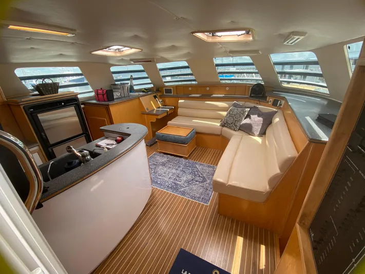 Lah De Dah Yacht Photos Pics Luxurious interior of 2007 Manta 44 Power Cat with modern kitchen and seating area.