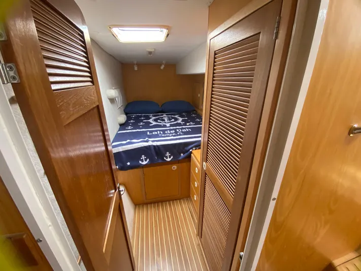 Lah De Dah Yacht Photos Pics Cozy cabin interior of 2007 Manta 44 Power Cat with nautical bedding.
