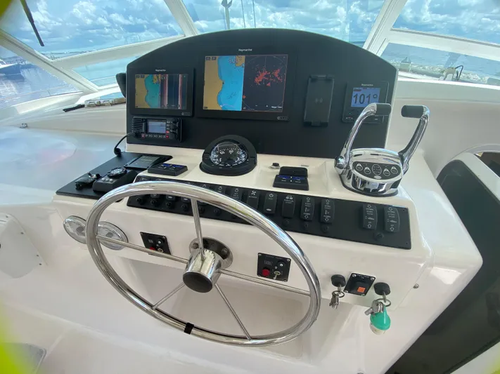 Lah De Dah Yacht Photos Pics 2007 Manta 44 Power Cat helm with navigation screens and controls.