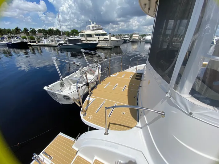 Lah De Dah Yacht Photos Pics 2007 Manta 44 Power Cat docked at marina under cloudy sky.