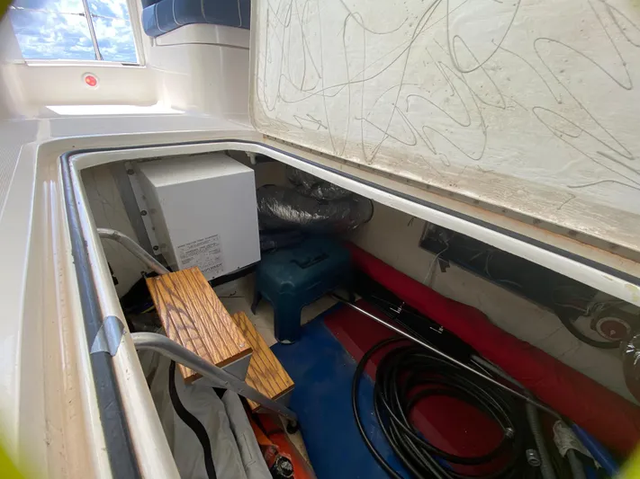 Lah De Dah Yacht Photos Pics Storage compartment of 2007 Manta 44 Power Cat with various equipment and tools.