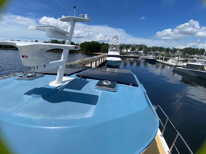 Lah De Dah Yacht Photos Pics 2007 Manta 44 Power Cat docked at marina under clear blue sky.