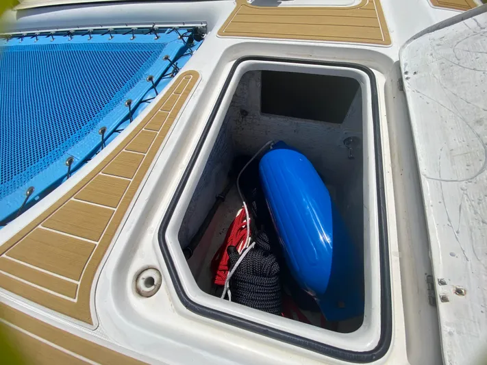 Lah De Dah Yacht Photos Pics Storage compartment on 2007 Manta 44 Power Cat with blue fender and ropes.