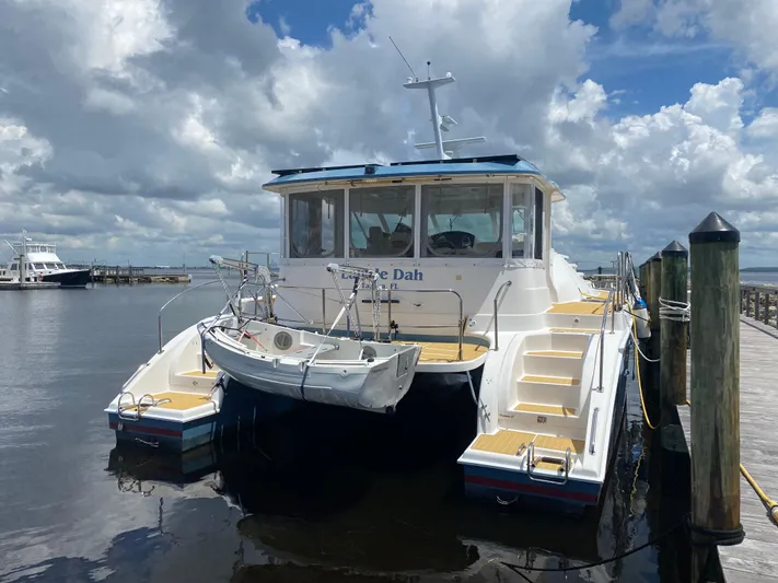 Lah De Dah Yacht Photos Pics 2007 Manta 44 Power Cat docked under cloudy skies.