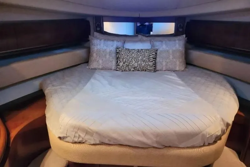  Yacht Photos Pics Luxurious bedroom interior of 2005 Sea Ray 500 Sundancer yacht with plush bedding.