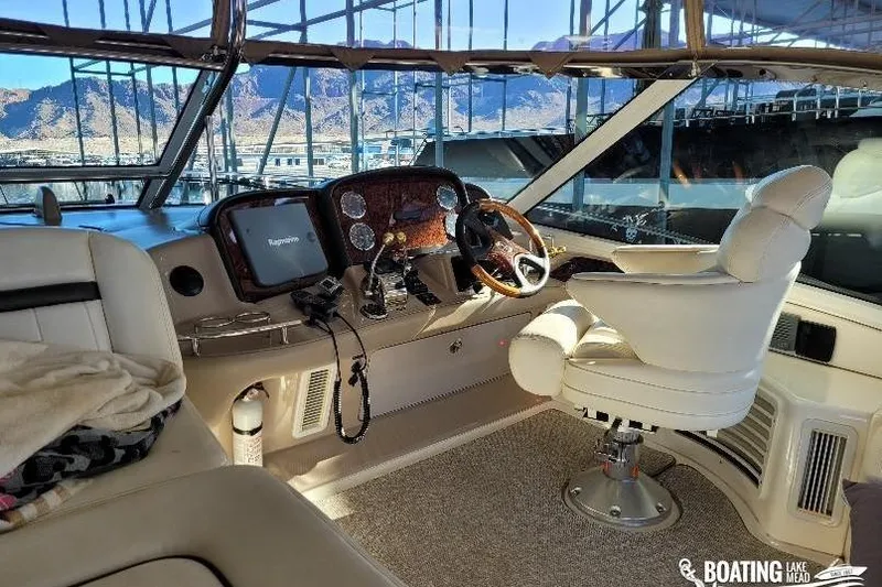  Yacht Photos Pics 2005 Sea Ray 500 Sundancer helm with luxurious seating and panoramic views.
