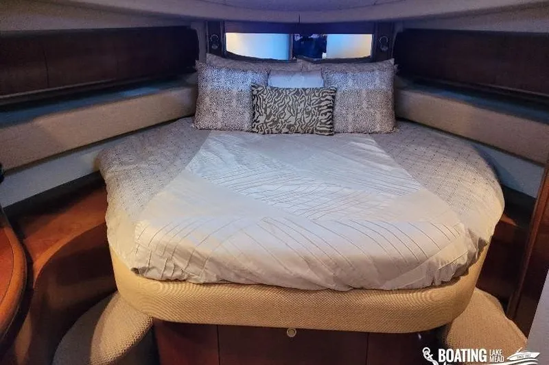  Yacht Photos Pics Luxurious bedroom interior of 2005 Sea Ray 500 Sundancer yacht with plush bedding.