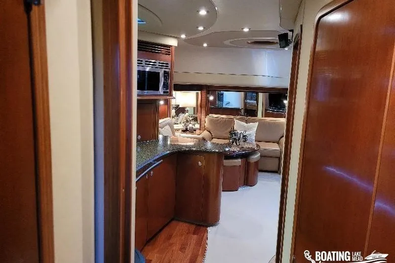  Yacht Photos Pics Luxurious interior of 2005 Sea Ray 500 Sundancer yacht with elegant wood finishes.