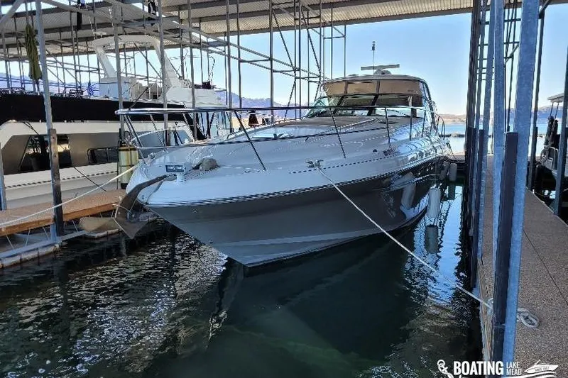  Yacht Photos Pics 2005 Sea Ray 500 Sundancer yacht docked in a marina, sheltered under a canopy.