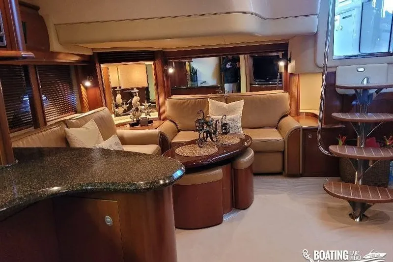  Yacht Photos Pics Luxurious interior of 2005 Sea Ray 500 Sundancer yacht with elegant seating and decor.