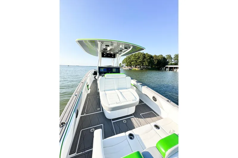  Yacht Photos Pics 2023 Statement 350 Open boat with sleek design on a serene lake.