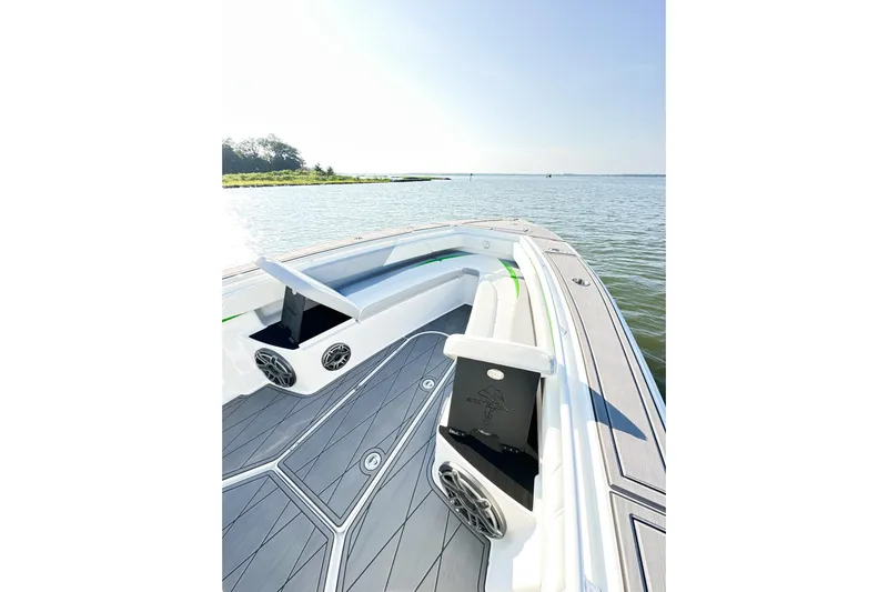  Yacht Photos Pics 2023 Statement 350 Open boat interior with sleek seating and modern design on calm water.