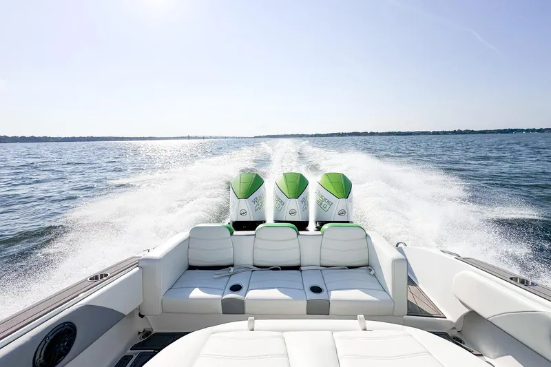  Yacht Photos Pics 2023 Statement 350 Open boat cruising on open water with triple engines.