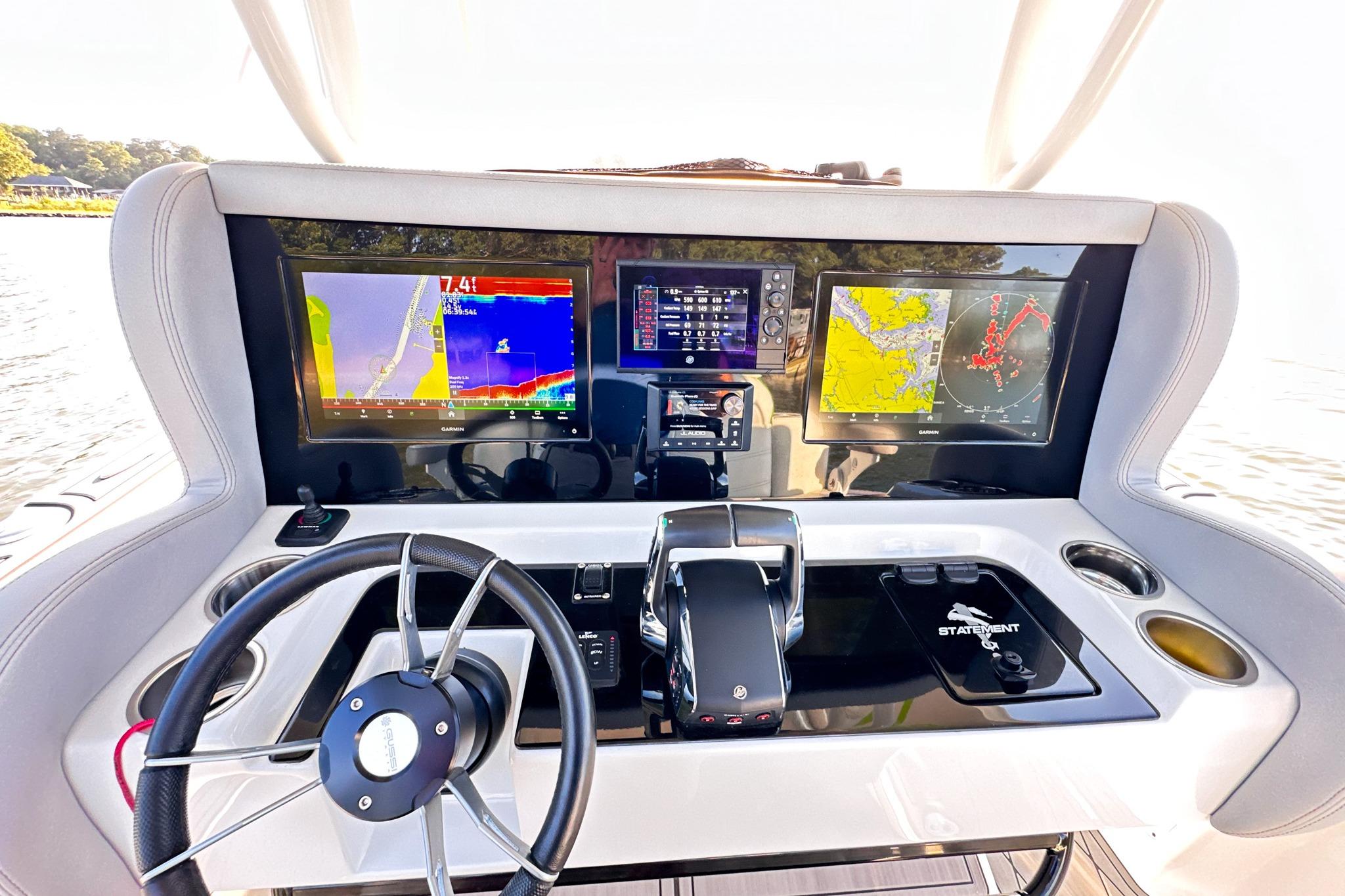 2023 Statement 350 Open boat dashboard with advanced navigation displays and controls.