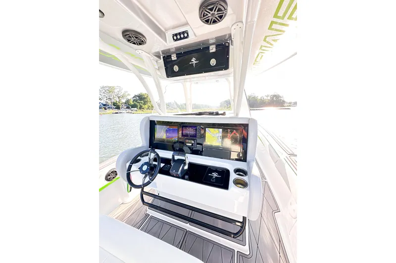 Yacht Photos Pics 2023 Statement 350 Open boat cockpit with advanced navigation displays and steering wheel.