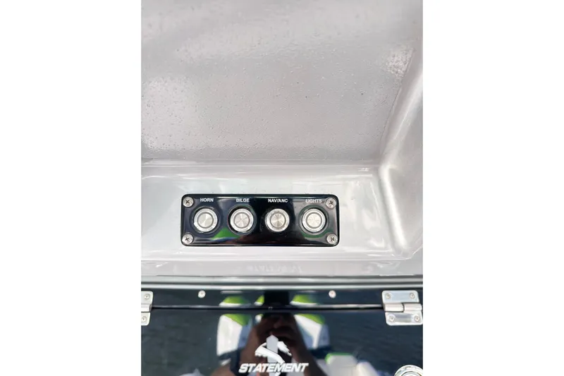 Yacht Photos Pics Control panel of 2023 Statement 350 Open boat with horn, bilge, nav, and lights switches.