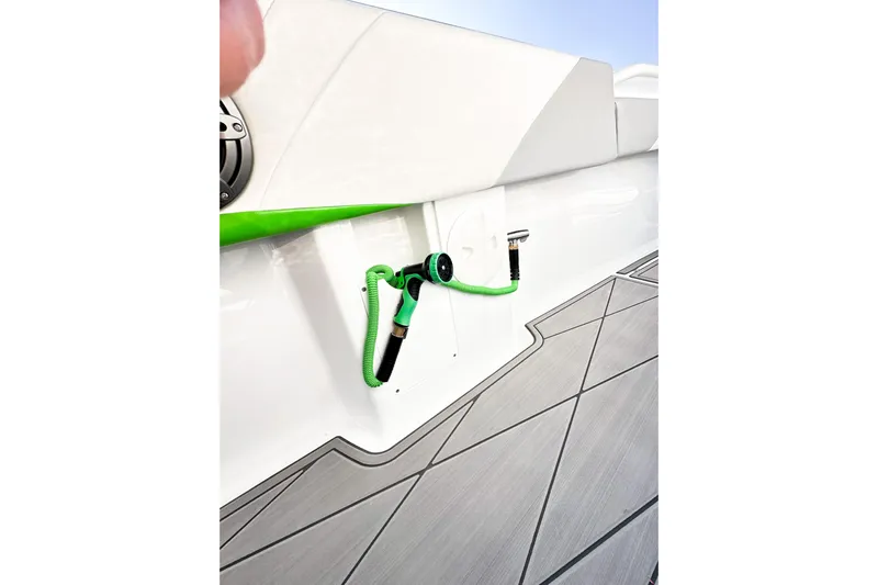  Yacht Photos Pics 2023 Statement 350 Open boat deck with green hose and sleek design.