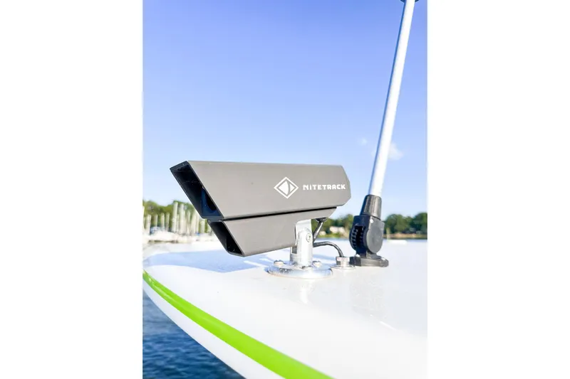  Yacht Photos Pics NITETRACK device on 2023 Statement 350 Open boat, docked with clear sky background.