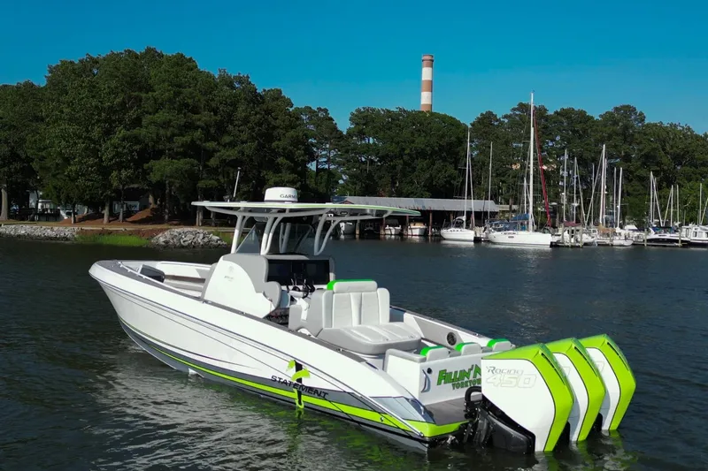  Yacht Photos Pics 2023 Statement 350 Open boat with vibrant green accents docked near a marina.