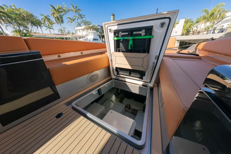 Why Her Yacht Photos Pics 2024 Wajer 55 HT yacht interior with open storage compartment, luxury seating, and teak flooring.