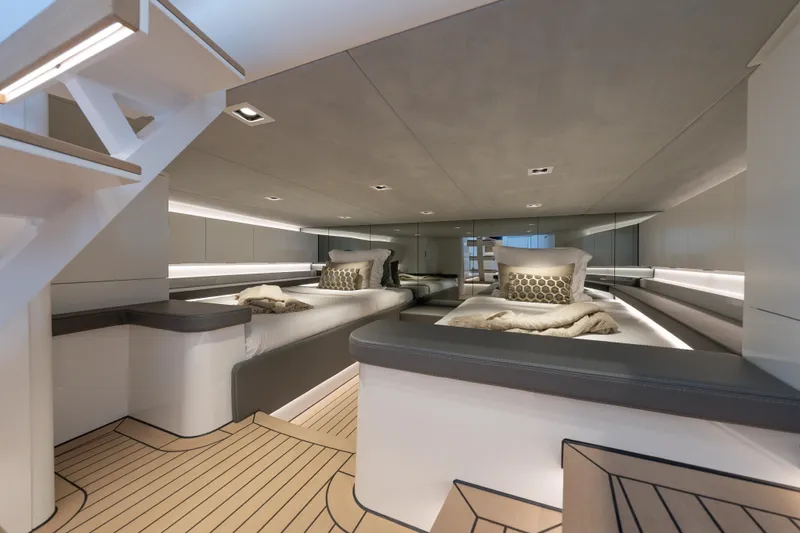 Why Her Yacht Photos Pics Luxurious interior of 2024 Wajer 55 HT yacht with modern twin beds and elegant lighting.