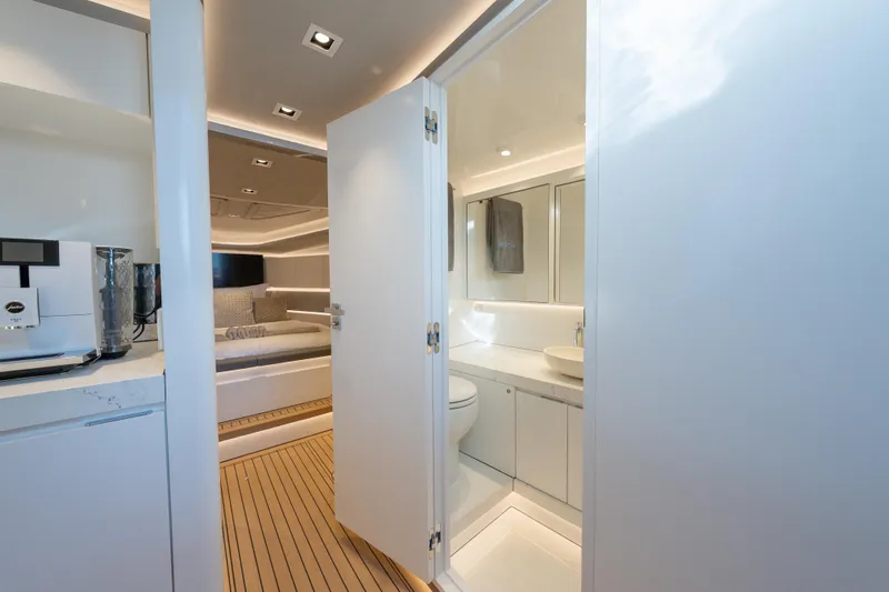 Why Her Yacht Photos Pics Luxurious interior of 2024 Wajer 55 HT yacht featuring modern bathroom and cozy cabin.