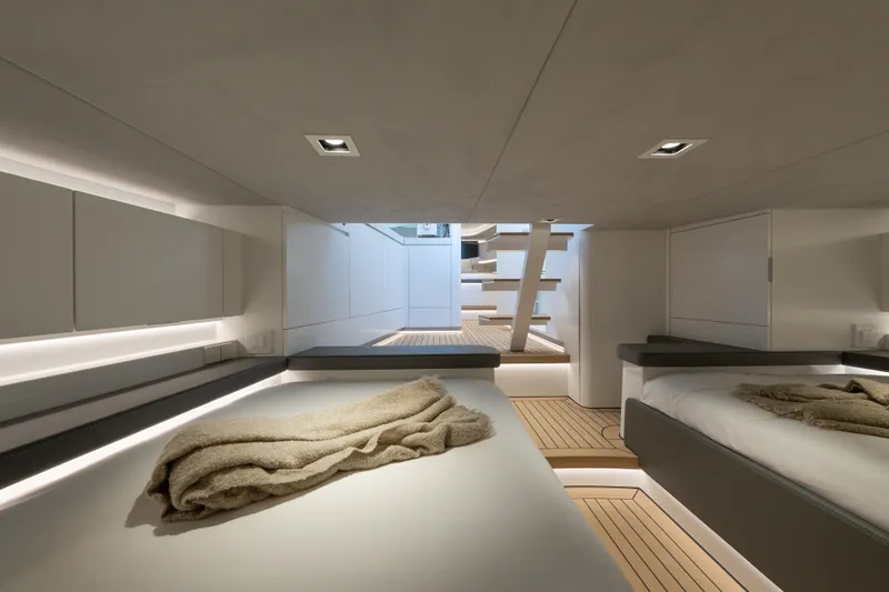 Why Her Yacht Photos Pics Luxurious interior of 2024 Wajer 55 HT yacht, featuring modern design and cozy bedding.
