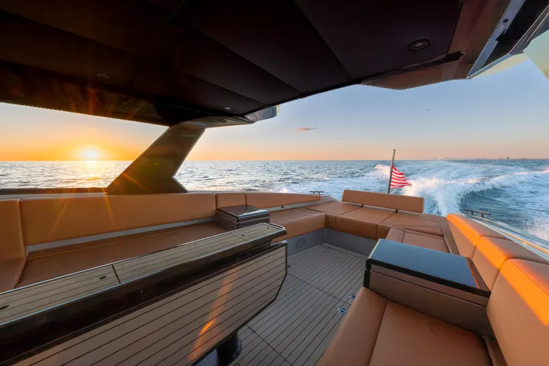 Why Her Yacht Photos Pics 2024 Wajer 55 HT yacht interior with sunset ocean view and American flag.