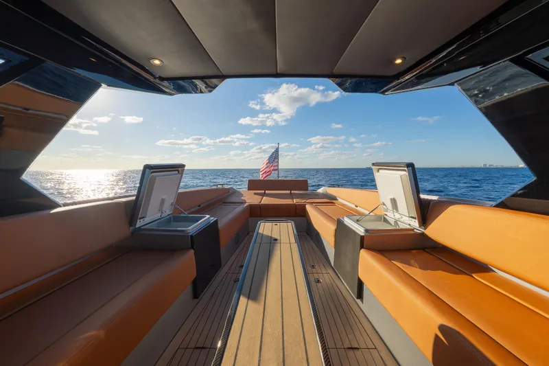 Why Her Yacht Photos Pics 2024 Wajer 55 HT yacht interior with luxurious seating, open sea view, and American flag.