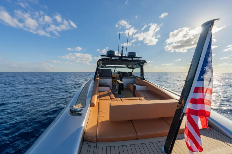 Why Her Yacht Photos Pics 2024 Wajer 55 HT yacht on open sea with American flag, sunny day.